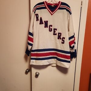 Rangers White and Blue Hockey Jersey Mike Gartner Jersey.Size is a Large.
